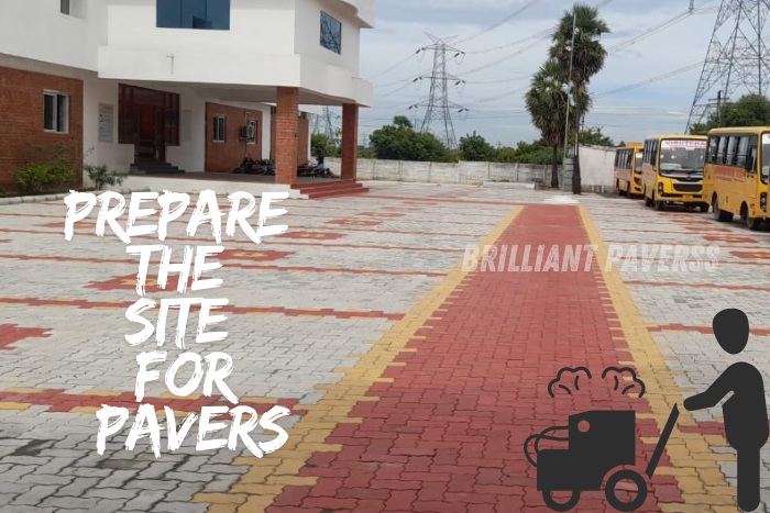 Large paved area in front of a building featuring red, yellow, and gray paver blocks, with the text "Prepare the Site for Pavers" and an illustration of a worker using a compactor, showcasing Brilliant Paverss' expertise in site preparation and high-quality paver installations in Coimbatore