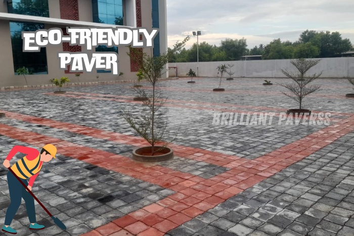 Expansive paved area featuring eco-friendly red and gray paver blocks arranged around young trees, with the text "Eco-Friendly Paver" and an illustration of a worker planting, highlighting Brilliant Paverss' commitment to sustainable paving solutions in Coimbatore